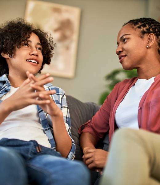 African,American,Teenager,Talking,And,Woman,Listening,While,Sitting,Together