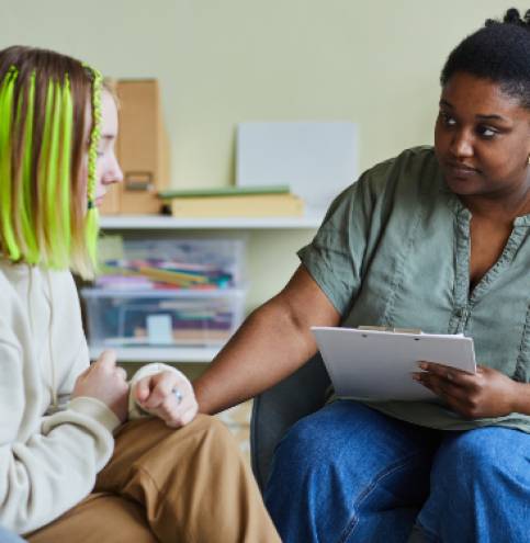 African female school psychologist supporting sad teenage girl during her difficult situation at school SSUCv3H4sIAAAAAAAACpxUy27bMBC8F+g/GDqHAB8iJeYLeuy96GFJriwismhIVFojyL+Xetl04lx6E2d3ZofU7r59/3Y4FAZGb4vnw9t8SmffddMYB4g+9AmmTxs+YO9wyJHXQSiaA+h8DIOHLgcNRNv2cMIE9lPXzfD7EizGCHEaccyqMy6GJp3ZTh/bKUYcxhjsS8LFVdYfF+zchhhywtn/jTADWSELEY/J2V2p/eK/1vNhDyzBxEihothUVyuTWbAdWsX/i7l+/N49wxF7e7l5+3zvq8n5jcRVaFeYNVww+DCdcikfMdyAcBqjX37NHYPpO/uaP6J//AO5wk8M5w7vRH4gdLF96LyD0+WDgLBK1TUY0lTWktI2lNRKIdGMpQhyahp67xE54yVUhGuWCDXlRFtmSEltY7SqS9DuVnz9eM9aZMAOYe3FzUdB6yTTSEWANYyUpmwIlCCJEcppJ5njWu4eCqW1rFwtiRNOk1Irk5KNJhorrGvegFDNLdkKJTGlVBKSWY1JFCtFWMWlwspZtHoxu75S8fIntcJpad7NLkzOh6yZX4OFbk4Q2Z3Og7e+P2a0ENtlhneaDVMfh0vesEUXwhlM+nvPhyZp4o63MI4p3e14Pl9pY4RTVqcPcXnKTbVwaQDnIxOCUlZpSamohWZqe8BtFbQ+6Sx2doPTuQvg0N3NxnVJKCmV0pWsnr6aGzanVLSs5NeNu+awUtW3nOsWWWKcs3prmetemszJp0r3zh5W51Trzw235HiXb6QP7IIzpbmquV6bYSP6uWQhaOmUgZLUjM7NmQYESi5JiU5UQIVkqBLr/R8AAAD//wMAdE7Ev+UFAAA=